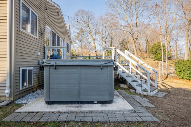 exterior space with a hot tub