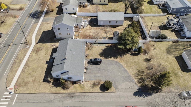 birds eye view of property with a residential view