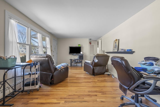 office featuring light wood-style floors and baseboards