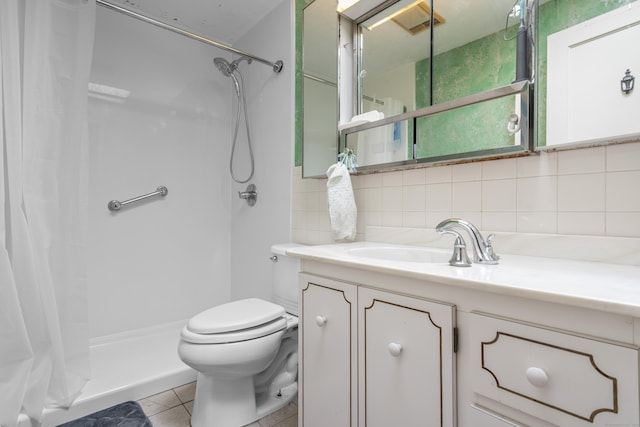 full bath featuring toilet, tile walls, a shower stall, tile patterned flooring, and vanity