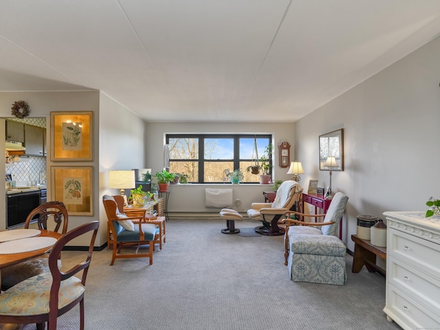 living area with carpet and baseboard heating