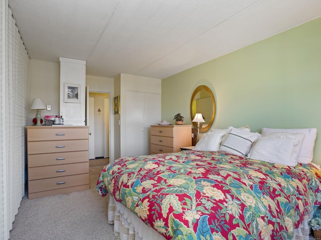 carpeted bedroom with a closet