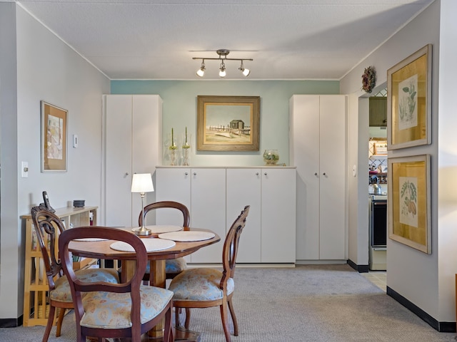 dining room with light carpet