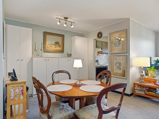 view of carpeted dining area