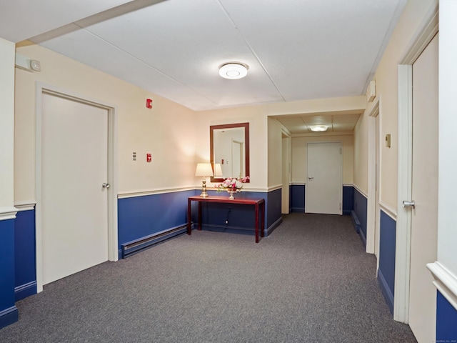 interior space with carpet flooring and baseboard heating