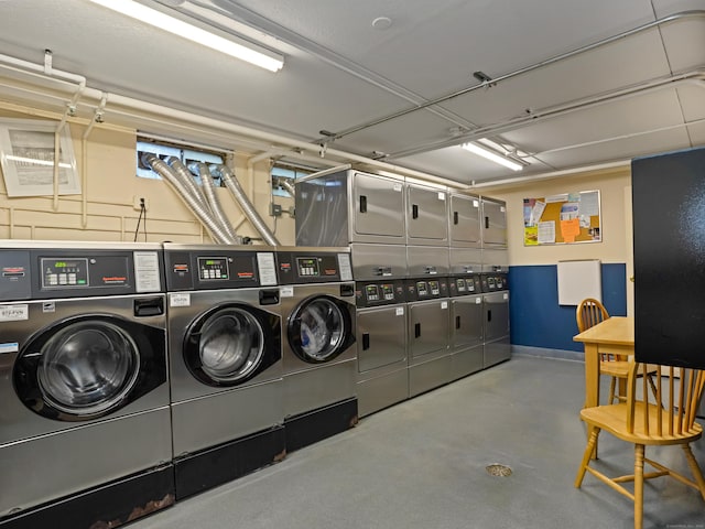 common laundry area with stacked washer and dryer, separate washer and dryer, and baseboards