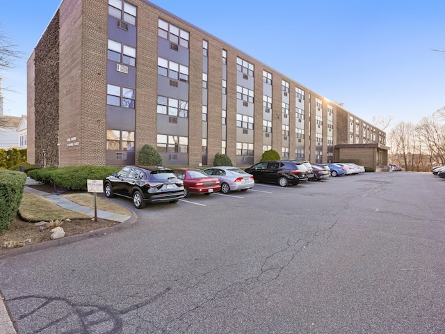 view of property featuring uncovered parking