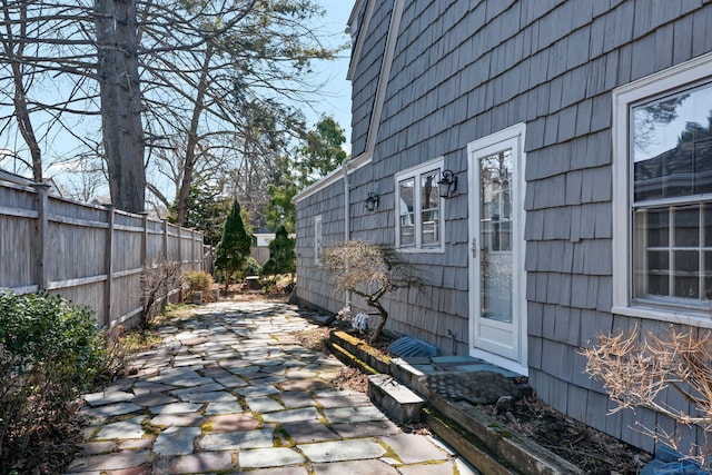 view of patio / terrace featuring fence