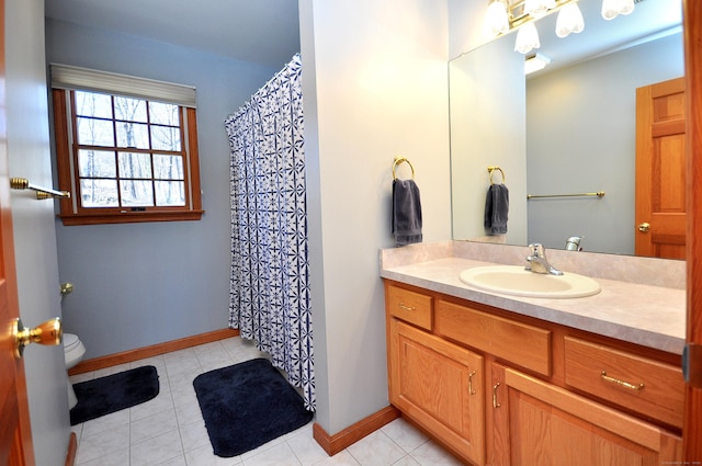 bathroom featuring tile patterned flooring, baseboards, toilet, a shower with curtain, and vanity