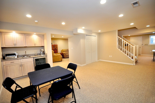 kitchen with beverage cooler, visible vents, recessed lighting, and baseboards