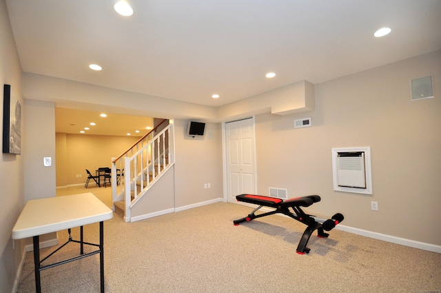 exercise room featuring visible vents, recessed lighting, baseboards, and carpet floors