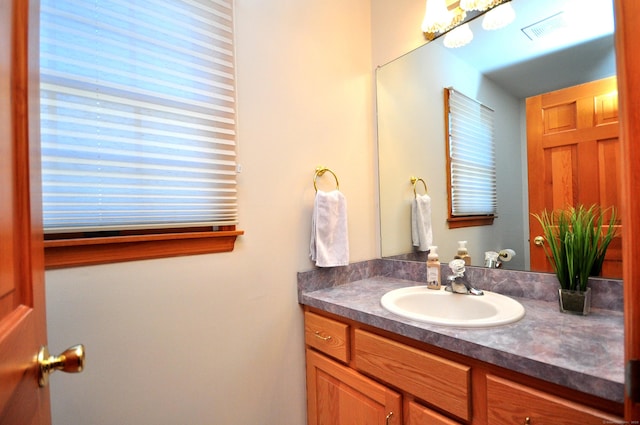 bathroom featuring visible vents and vanity