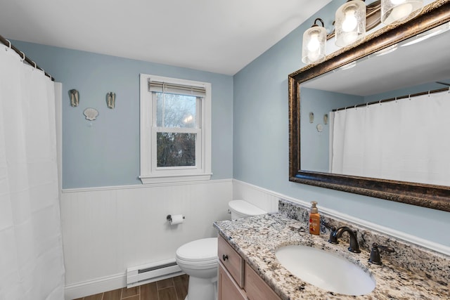 full bathroom featuring a wainscoted wall, toilet, wood finished floors, vanity, and a baseboard radiator