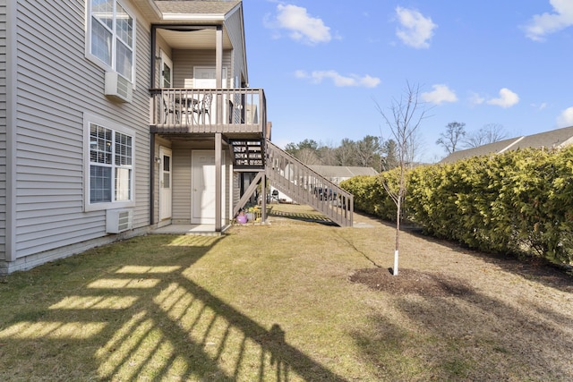 view of yard featuring stairway and a deck