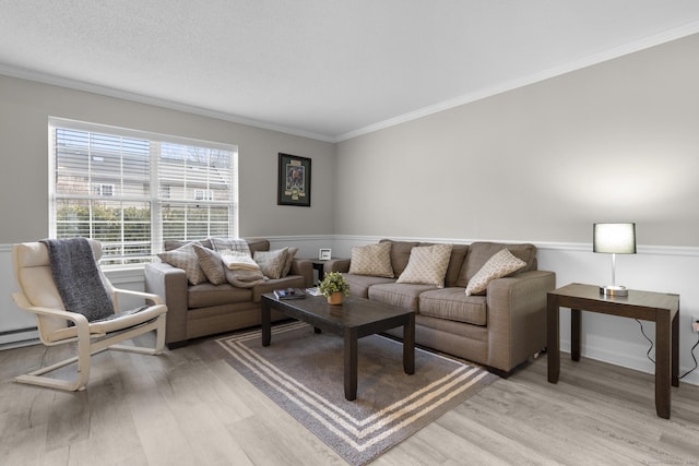 living room featuring light wood-type flooring and ornamental molding