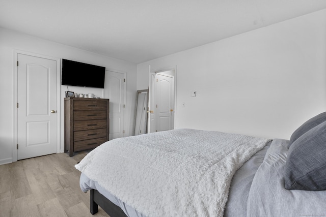 bedroom with light wood finished floors