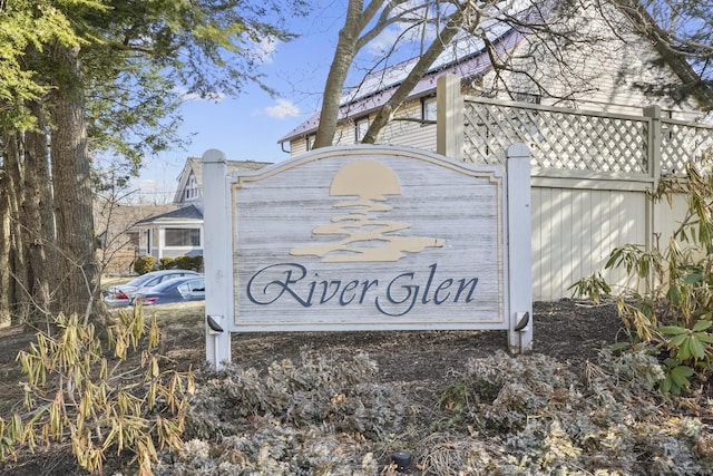 community sign featuring fence