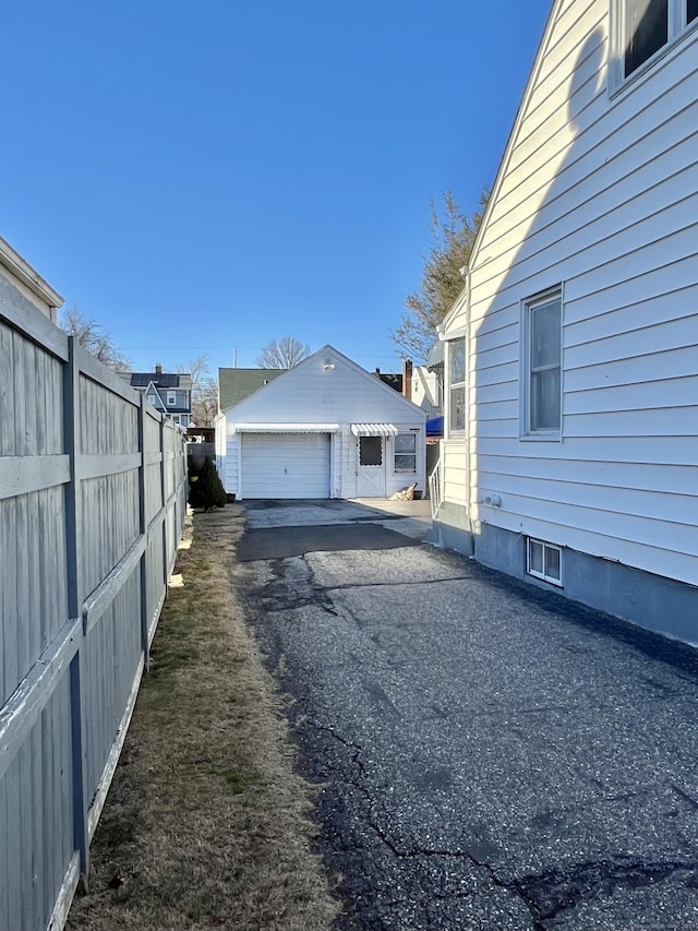 84 Glendale Ave, Bridgeport, CT 06606 - view of property exterior with fence and a garage