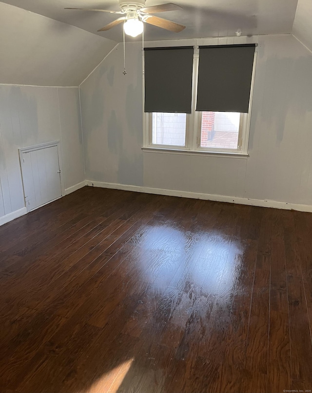 bonus room featuring ceiling fan, baseboards, lofted ceiling, and hardwood / wood-style floors