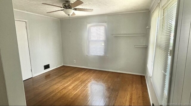 84 Glendale Ave, Bridgeport, CT 06606 - unfurnished bedroom with ornamental molding, wood finished floors, baseboards, a textured ceiling, and ceiling fan