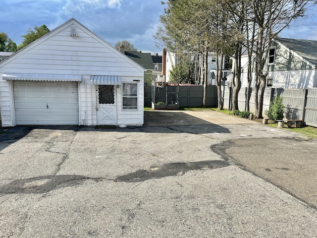 84 Glendale Ave, Bridgeport, CT 06606 - garage with fence and asphalt driveway