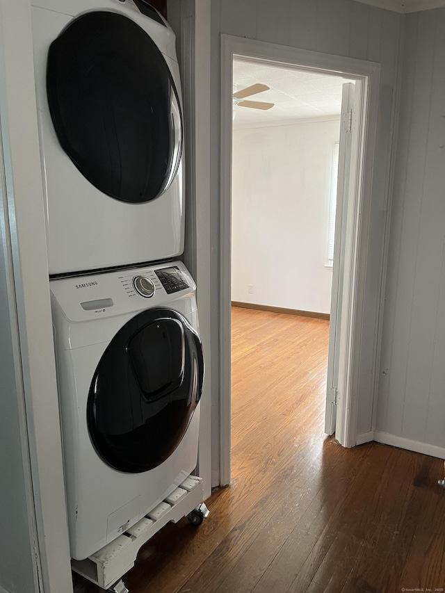 84 Glendale Ave, Bridgeport, CT 06606 - clothes washing area featuring estacked washer and dryer, wood finished floors, and ceiling fan