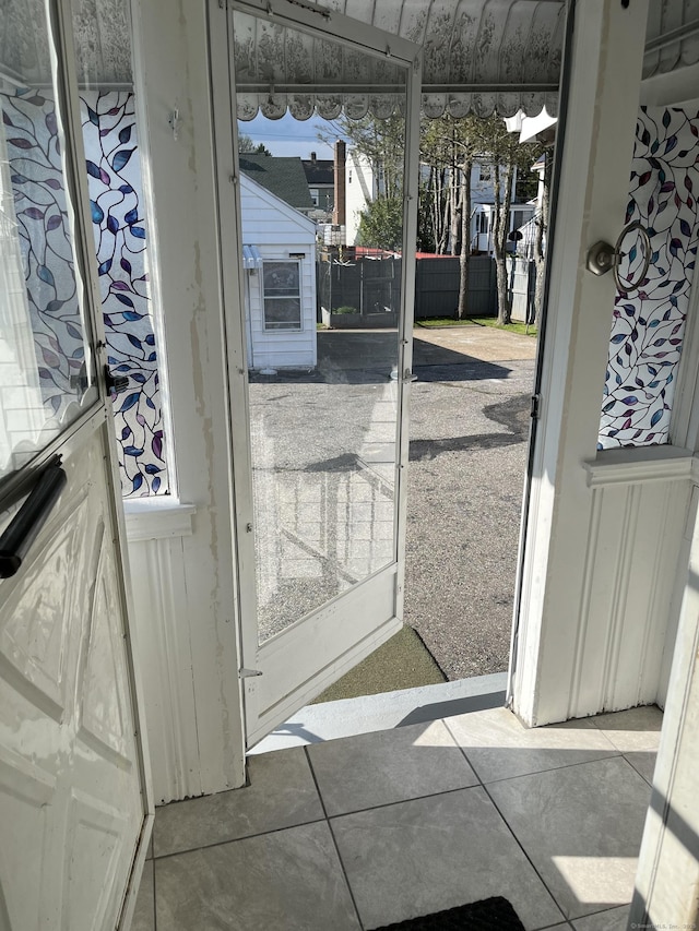 84 Glendale Ave, Bridgeport, CT 06606 - doorway to outside featuring tile patterned floors