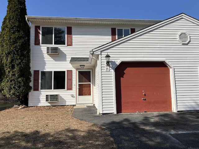 view of front of house with aphalt driveway and an attached garage