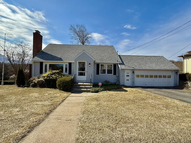 single story home featuring aphalt driveway, roof with shingles, and a chimney