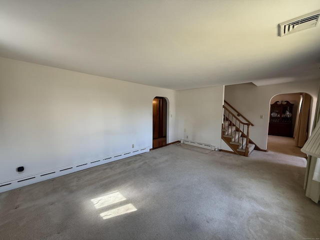 carpeted empty room with arched walkways, visible vents, stairway, and a baseboard radiator