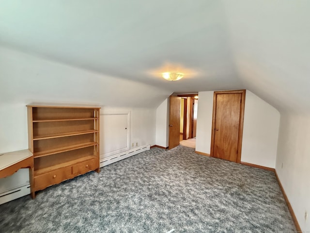 bonus room with lofted ceiling, carpet, a baseboard heating unit, and baseboards