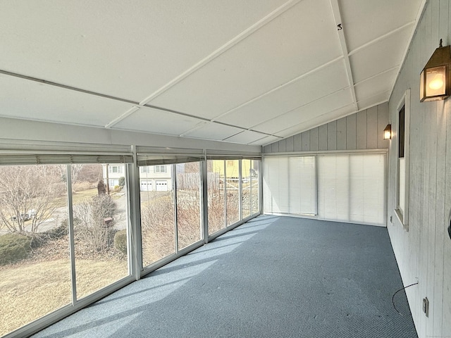 unfurnished sunroom with vaulted ceiling