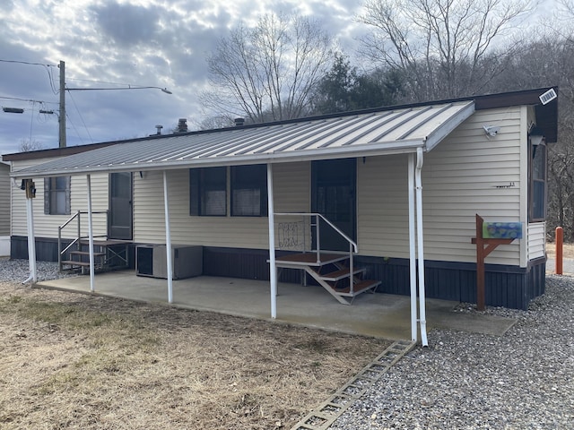 exterior space featuring metal roof