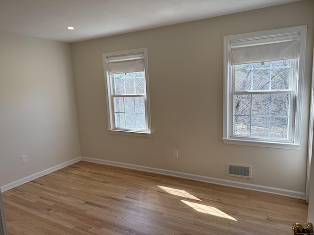 unfurnished room featuring recessed lighting, visible vents, baseboards, and light wood-style flooring