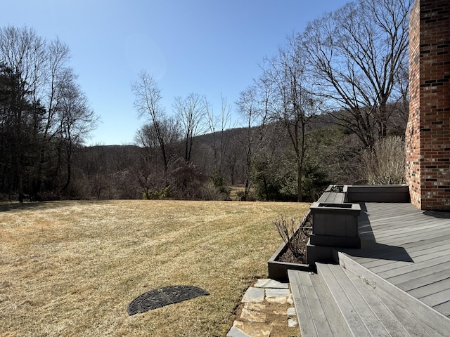 view of yard featuring a view of trees