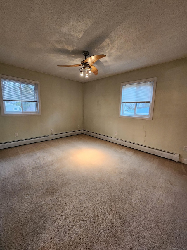 spare room featuring carpet floors, plenty of natural light, and ceiling fan