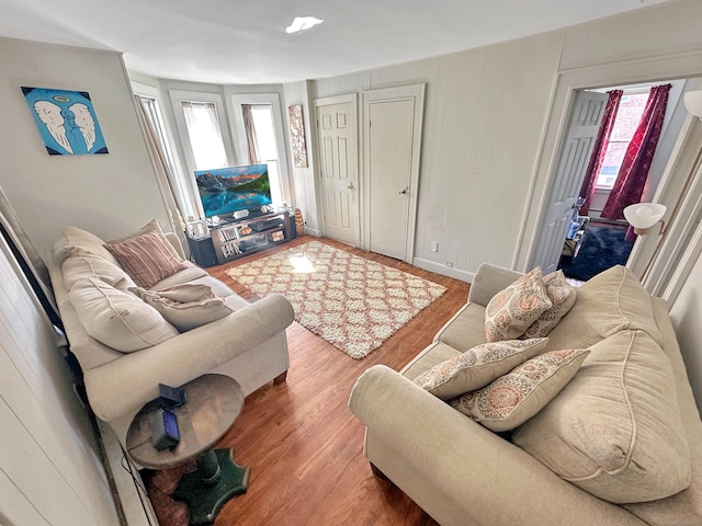 63 Minerva St, Derby, CT 06418 - living room featuring wood finished floors, baseboards, and a healthy amount of sunlight