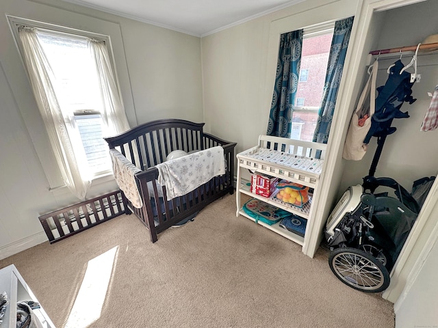 63 Minerva St, Derby, CT 06418 - carpeted bedroom featuring a crib and ornamental molding