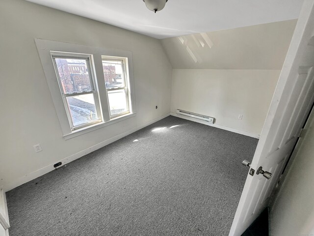 63 Minerva St, Derby, CT 06418 - bonus room featuring a baseboard heating unit, lofted ceiling, baseboards, and carpet floors