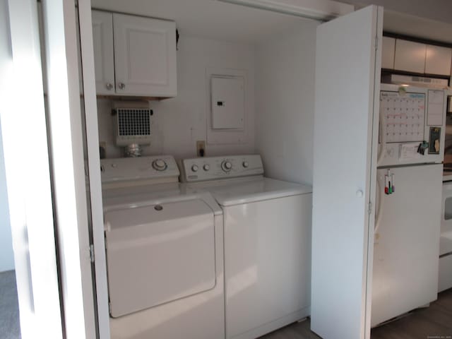 laundry room featuring washer and dryer, laundry area, and electric panel