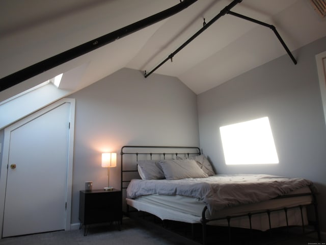 bedroom featuring carpet flooring and lofted ceiling