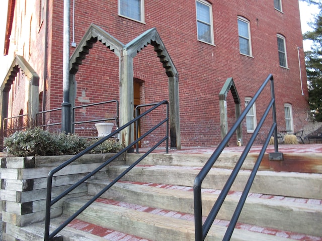 exterior space featuring brick siding