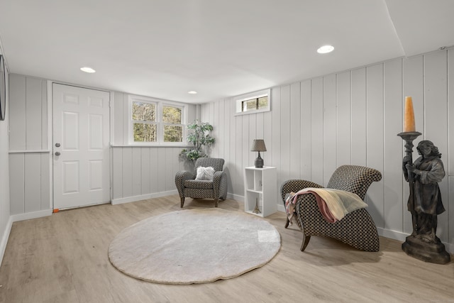 living area featuring recessed lighting, wood finished floors, and baseboards