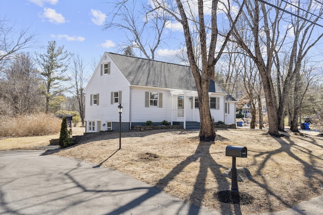 view of front of property with roof with shingles