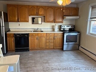 kitchen with under cabinet range hood, black appliances, brown cabinetry, and a sink