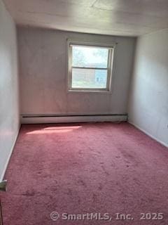 carpeted empty room featuring a baseboard radiator and baseboards