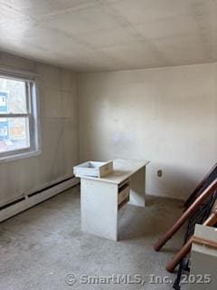 unfurnished office with baseboard heating