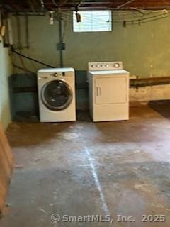 washroom featuring laundry area and washing machine and dryer