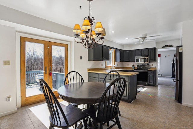 dining room with light tile patterned floors, baseboards, recessed lighting, french doors, and ceiling fan with notable chandelier