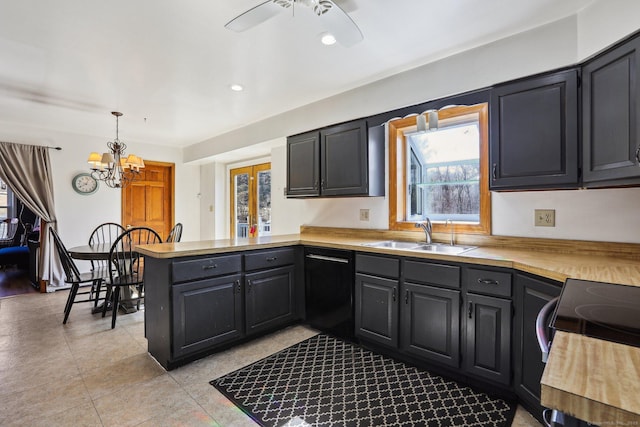 kitchen with a sink, decorative light fixtures, a peninsula, light countertops, and dishwasher